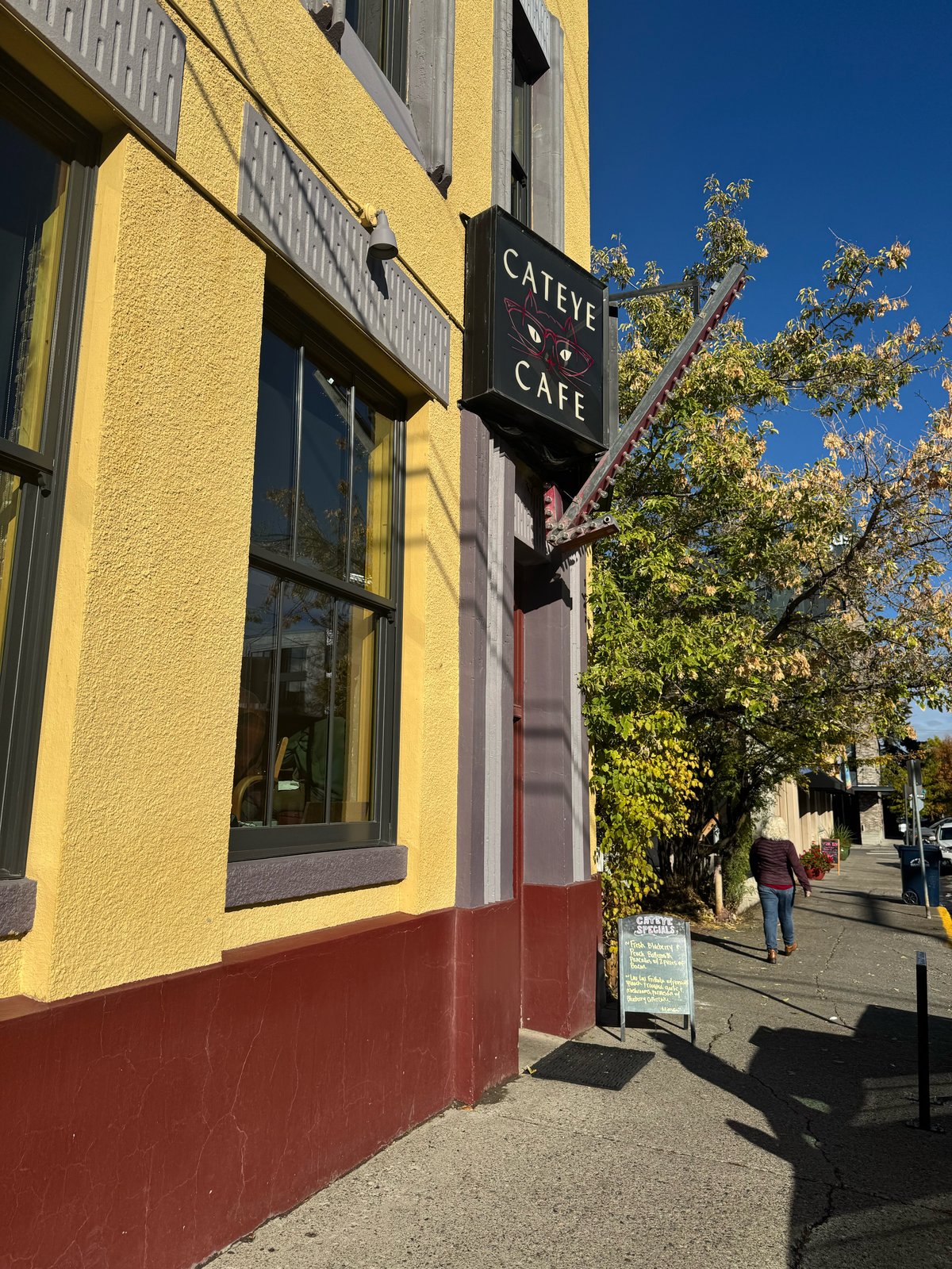 Cat Eye Café storefront and sidewalk sign on Tracy Avenue in downtown Bozeman